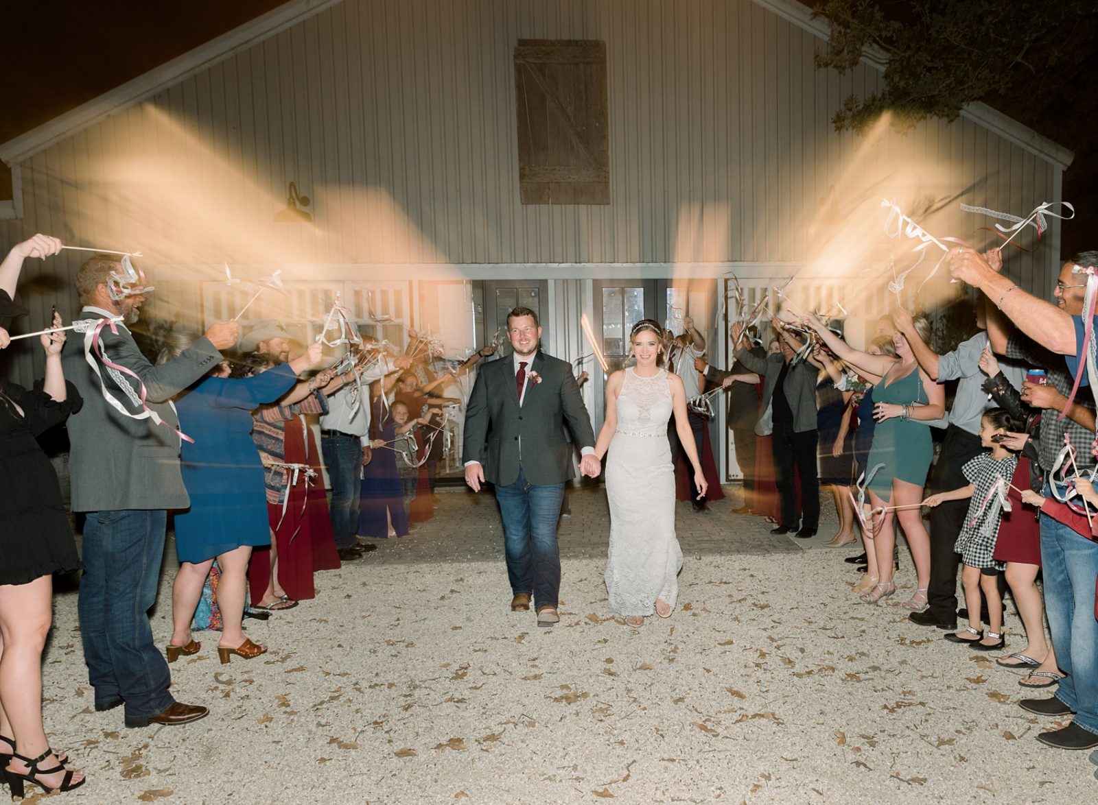vintage oaks ranch waco wedding venue light and airy wedding photographer in austin TX Tara Lyons Photography ribbon sendoff