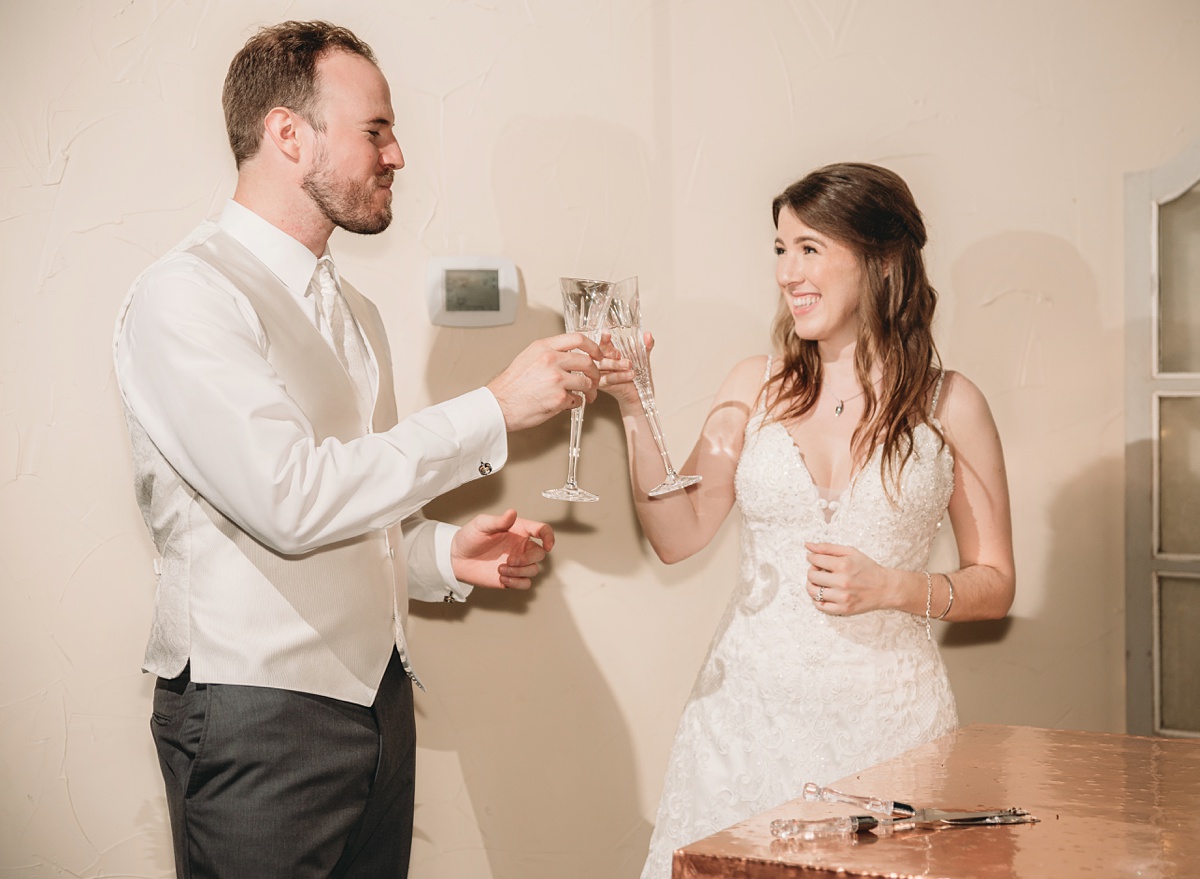 first toast as married couple, River Road Chateau, wedding photography at anna tx wedding venue