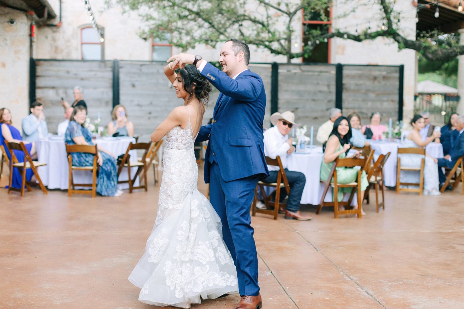 bride and groom first dance at reception, garey house reception decorations, cana events, florals by cana events, garey house wedding, reception at garey house, catholic wedding photography tips, photos by Tara Lyons Photography, Austin texas wedding photographer, garey house wedding