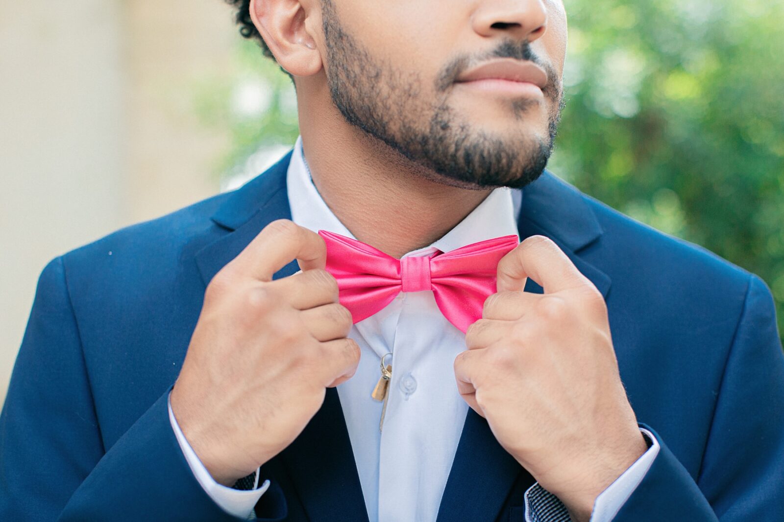 pink bow tie and navy suit for groom