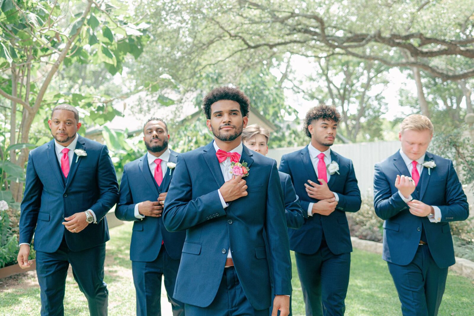 groom and groomsman portraits, hot pink groomsman details, Austin Wedding at Hummingbird House, with wedding photos by Tara Lyons Photography. Other vendors: Mistique Makeup, Cana Events, Twin Flame Events, Simply Chic Event Rentals, Live Oak Photo Booth