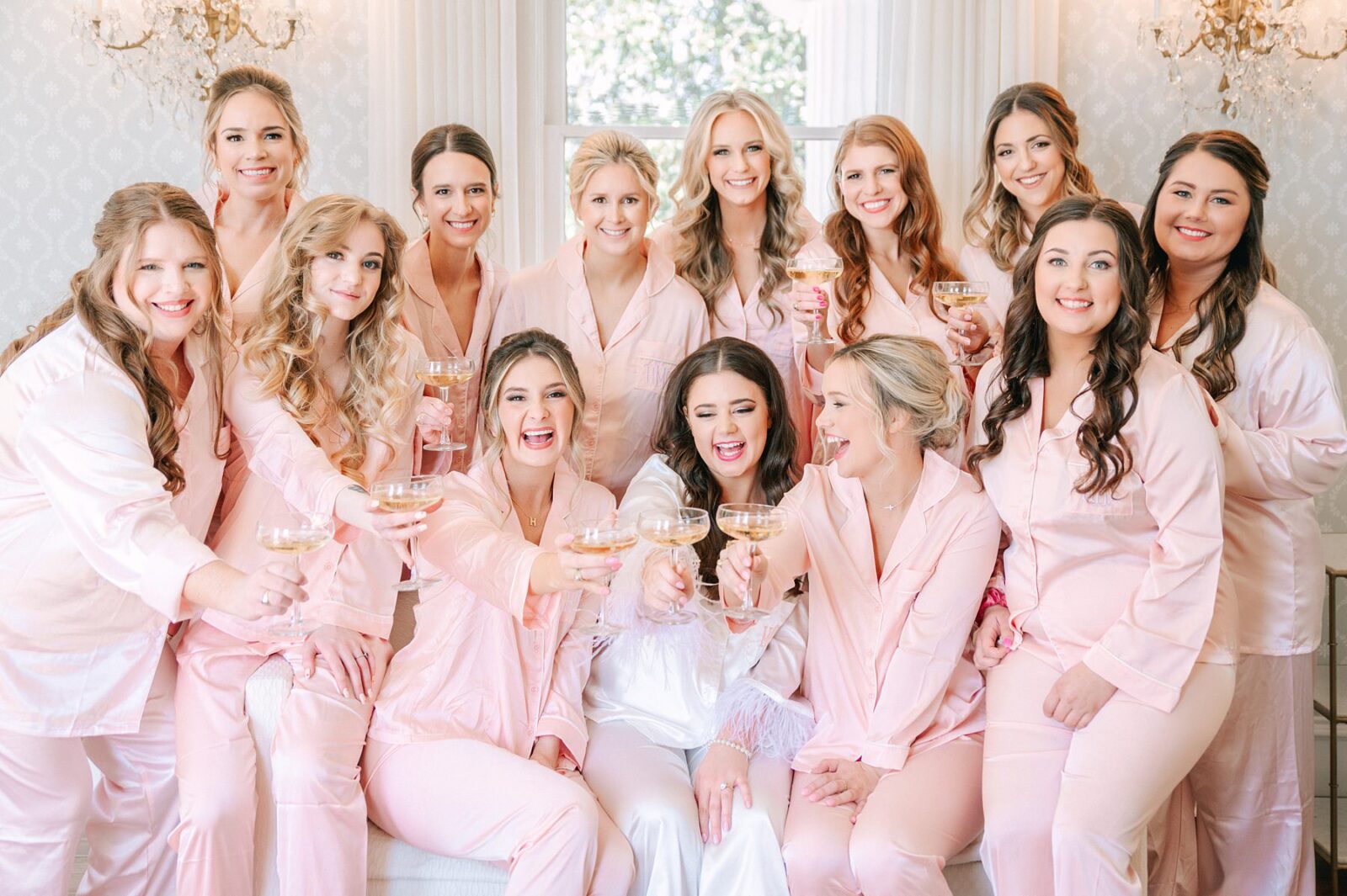 bride and bridesmaids champagne toast, getting ready at woodbine mansion, bridal suite at woodbine mansion, bride getting ready, large wedding party, twelve bridesmaids, at Woodbine mansion wedding venue, photography by Tara Lyons Photography, The event shop wedding planner