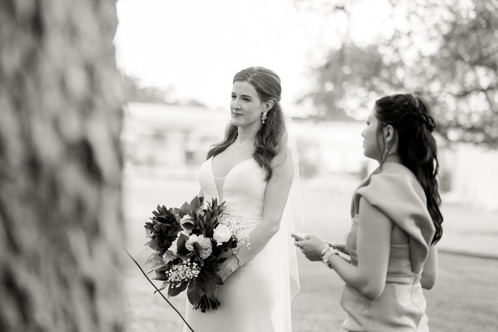 black and white wedding photos, bride hearing groom say vows